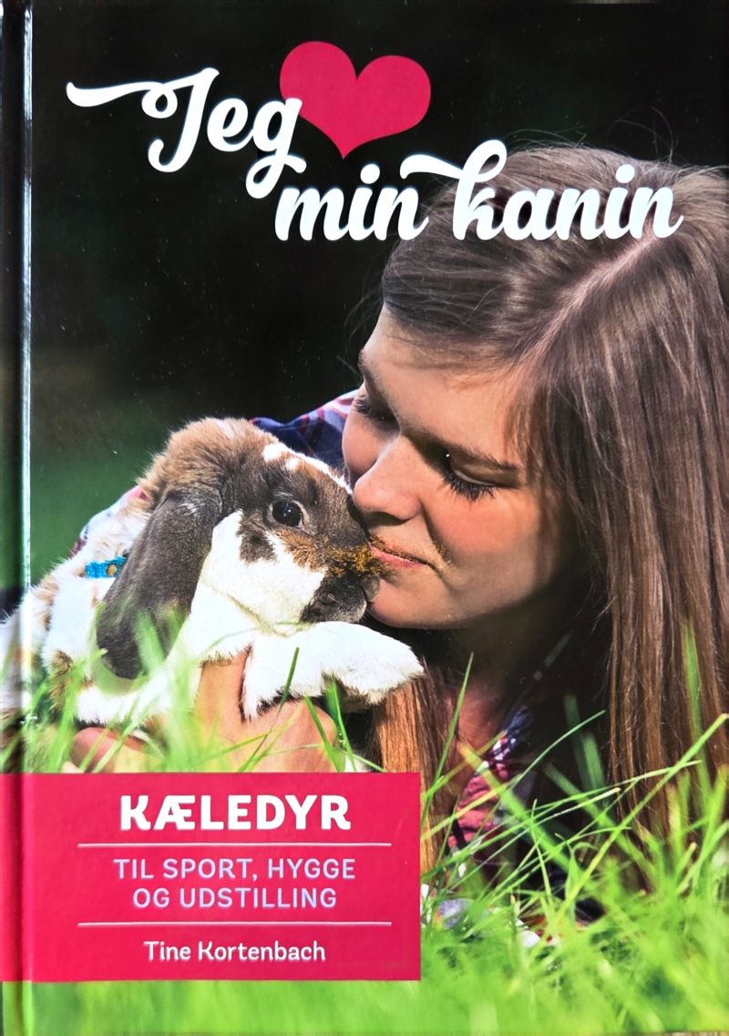 Forsiden af bogen Jeg elsker min kanin: en pige kysser en kanin i græsset